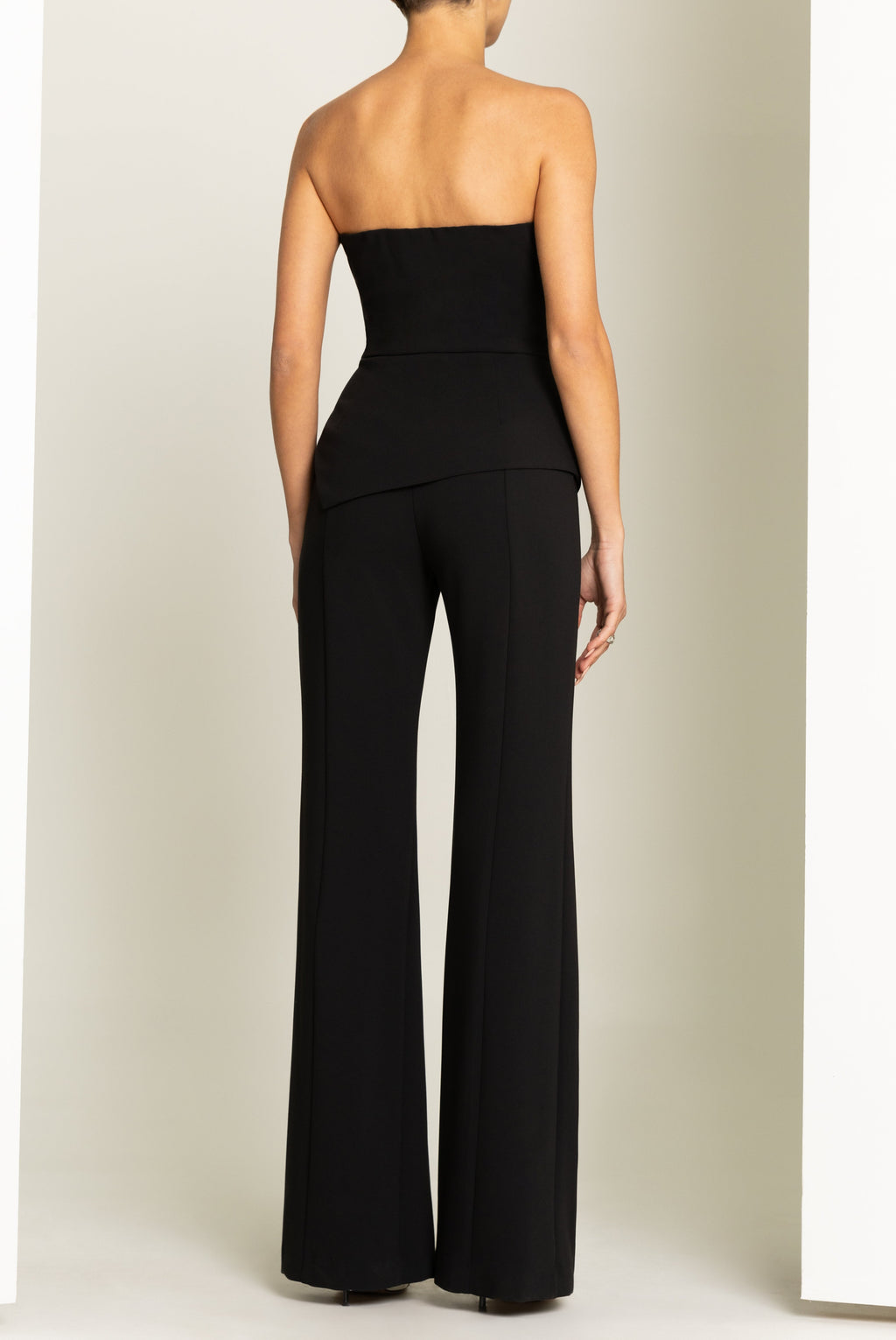 Rockie High-Stretch Woven Jumpsuit — Sunburst Bodice & Asymmetrical Peplum Waist