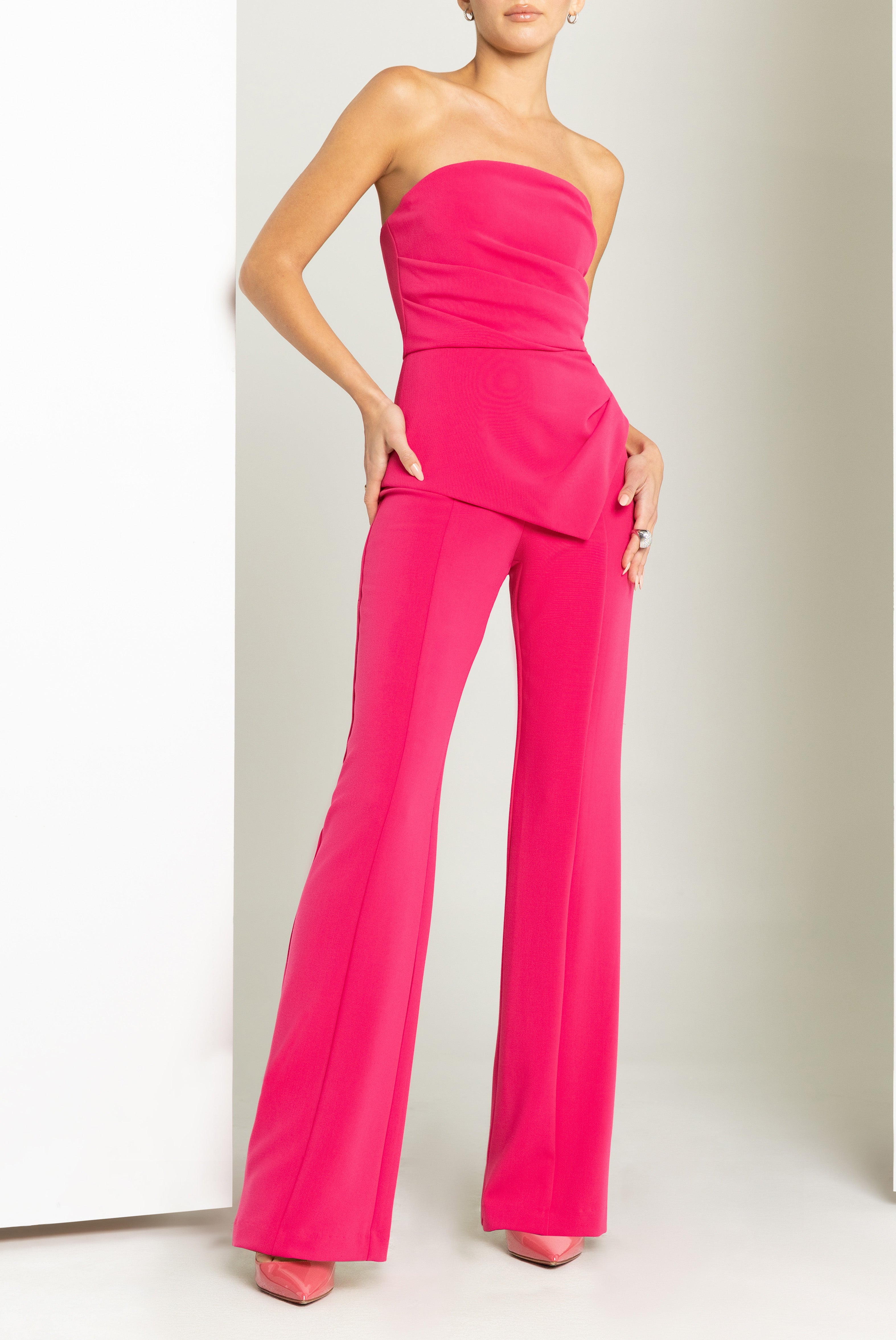 Rockie High-Stretch Woven Jumpsuit — Sunburst Bodice & Asymmetrical Peplum Waist