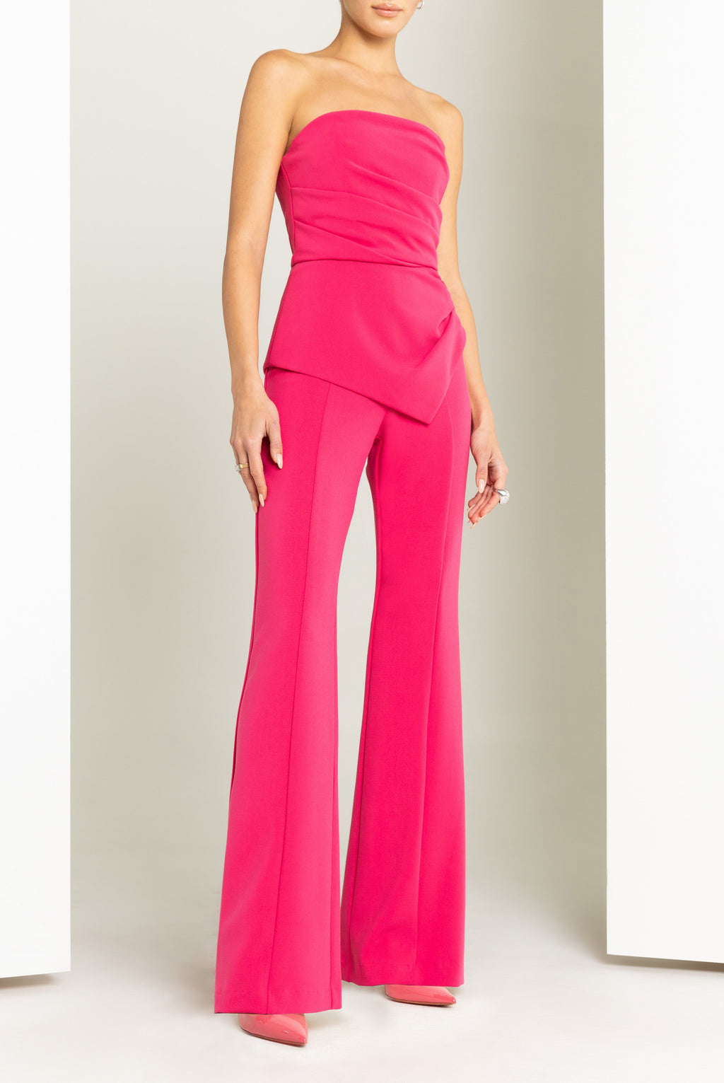 Rockie High-Stretch Woven Jumpsuit — Sunburst Bodice & Asymmetrical Peplum Waist