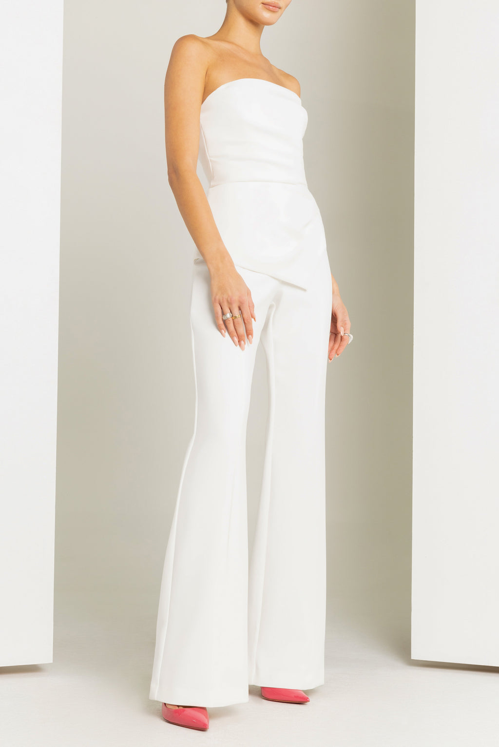 Rockie High-Stretch Woven Jumpsuit — Sunburst Bodice & Asymmetrical Peplum Waist